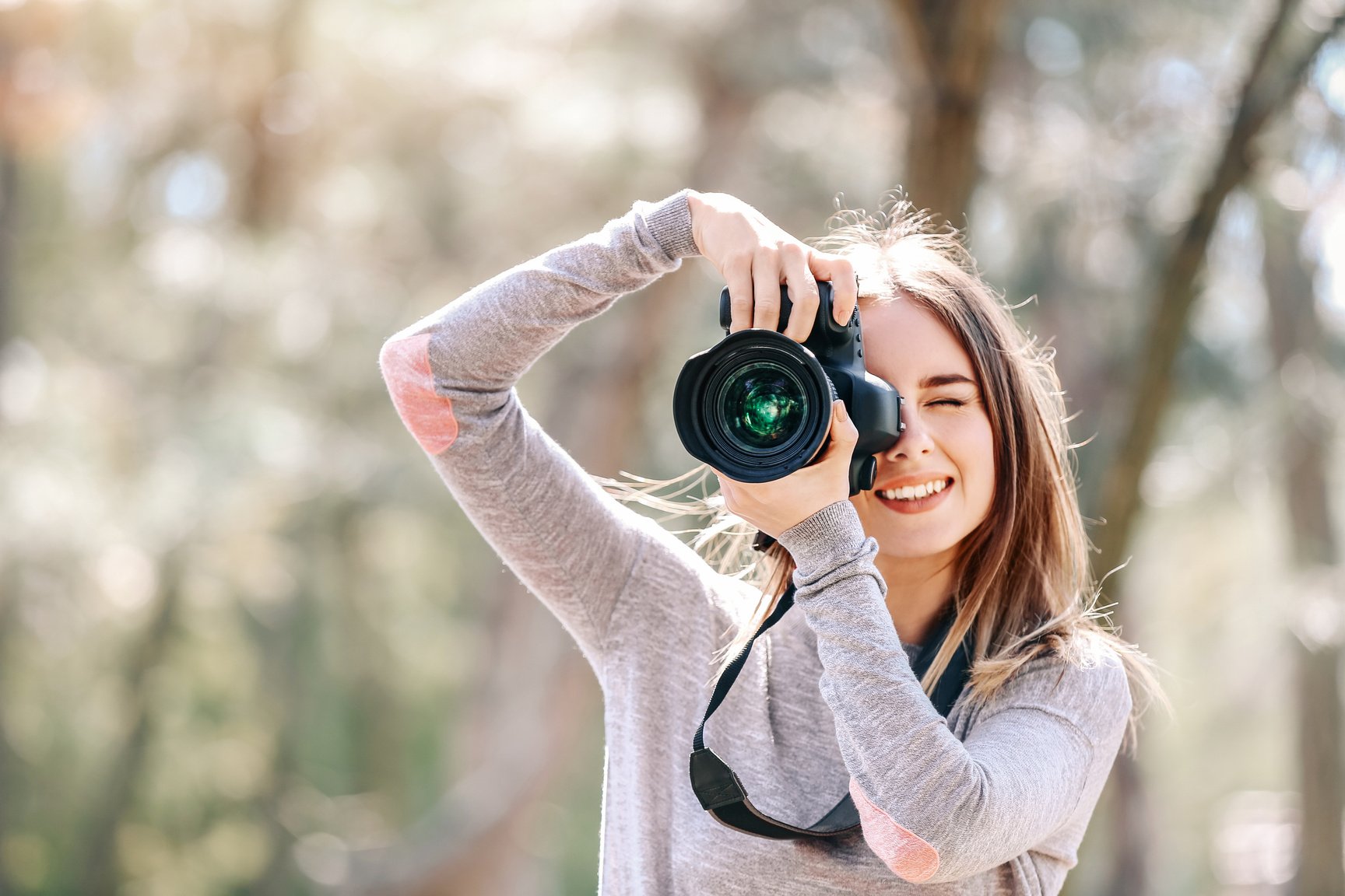 Beautiful Female Photographer Working Outdoors